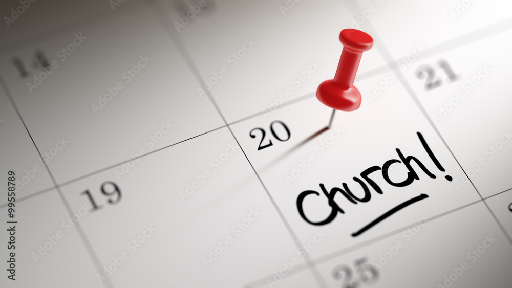 Concept image of a Calendar with a red push pin. Closeup shot of