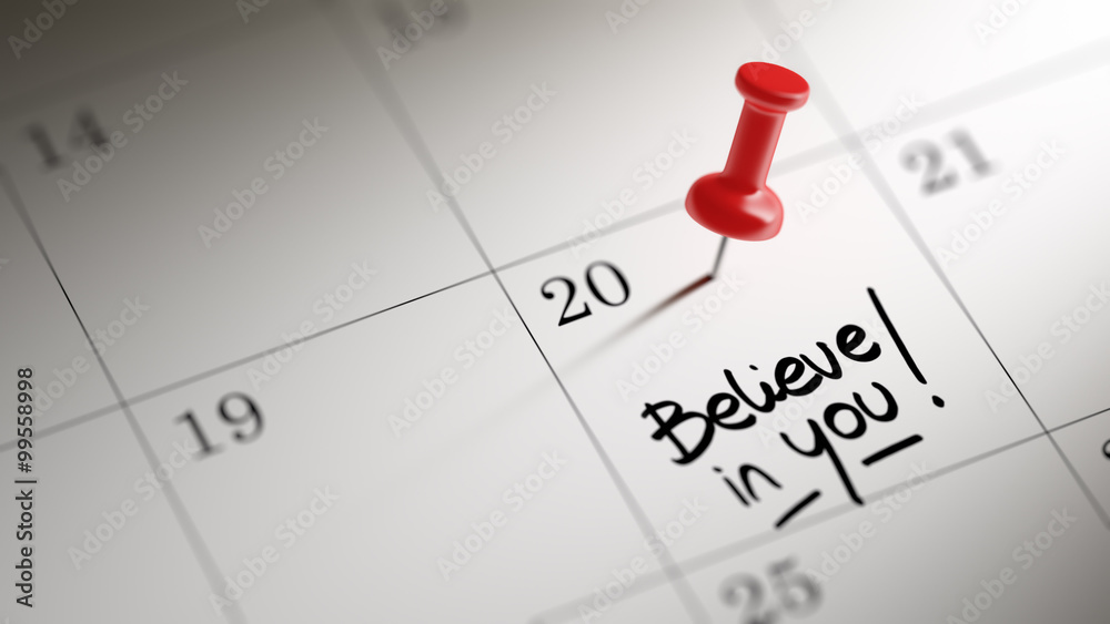 Concept image of a Calendar with a red push pin. Closeup shot of