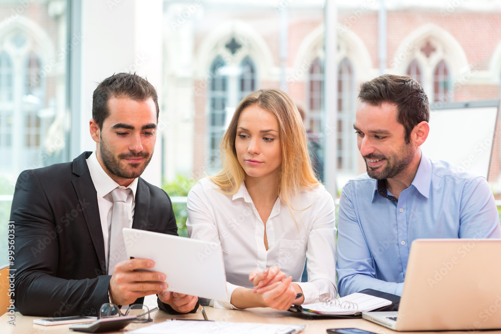 Group of business people working together at the office Group of business people working together at the office