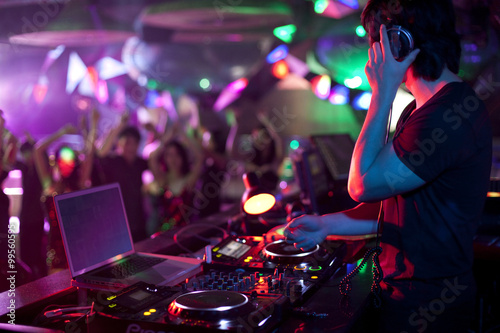 DJ doing record Scratching in nightclub