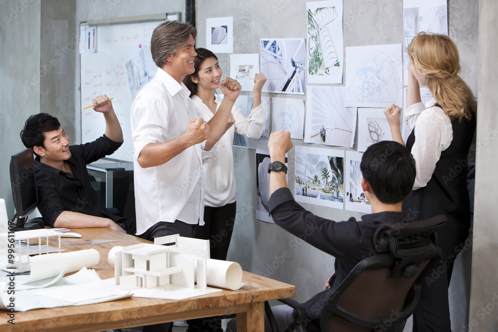 Fototapeta premium Architects celebrating in studio