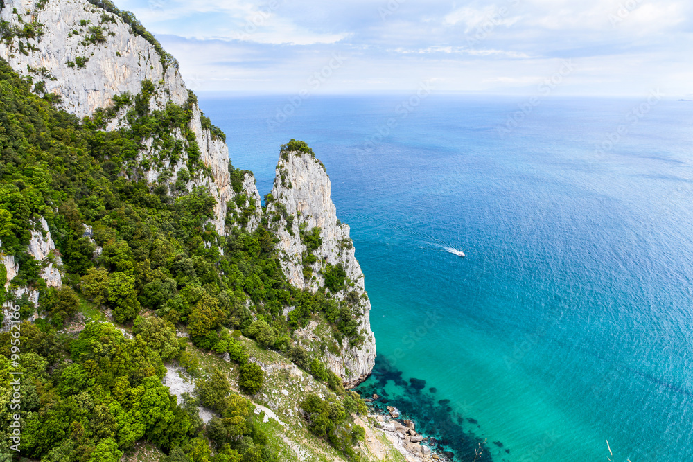 The picture shows a perspective view of the tip of the friar in Santoña, a town of Cantabria in Spain. Landscape characterized by its almost tropical waters.