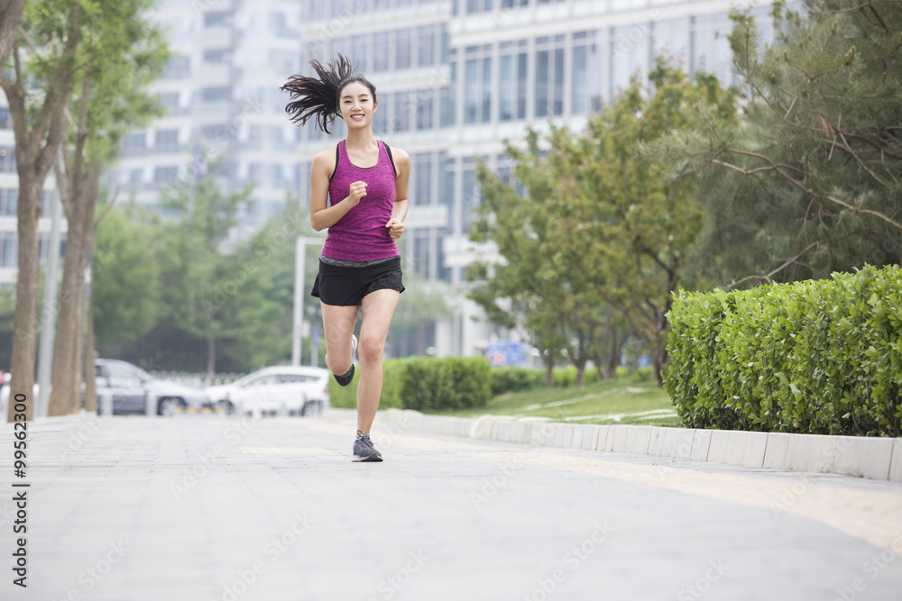 Young woman running outside Young woman running outside