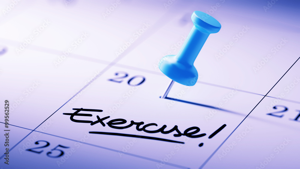 Concept image of a Calendar with a blue push pin. Closeup shot o Concept image of a Calendar with a blue push pin. Closeup shot o