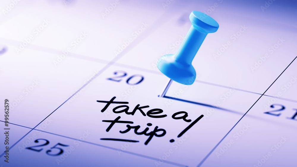 Concept image of a Calendar with a blue push pin. Closeup shot o Concept image of a Calendar with a blue push pin. Closeup shot o