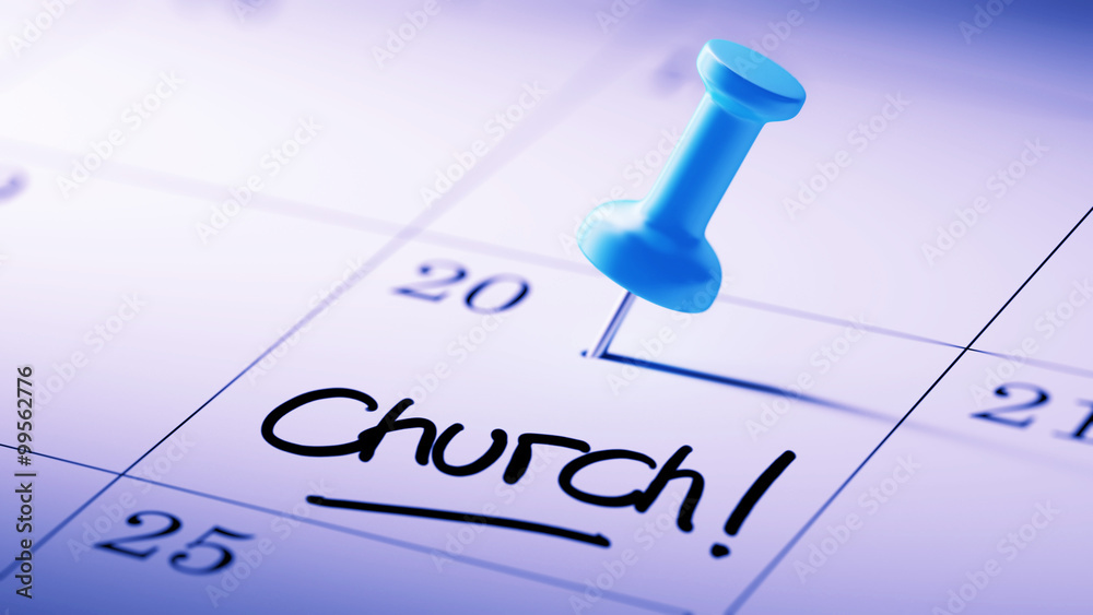 Concept image of a Calendar with a blue push pin. Closeup shot o