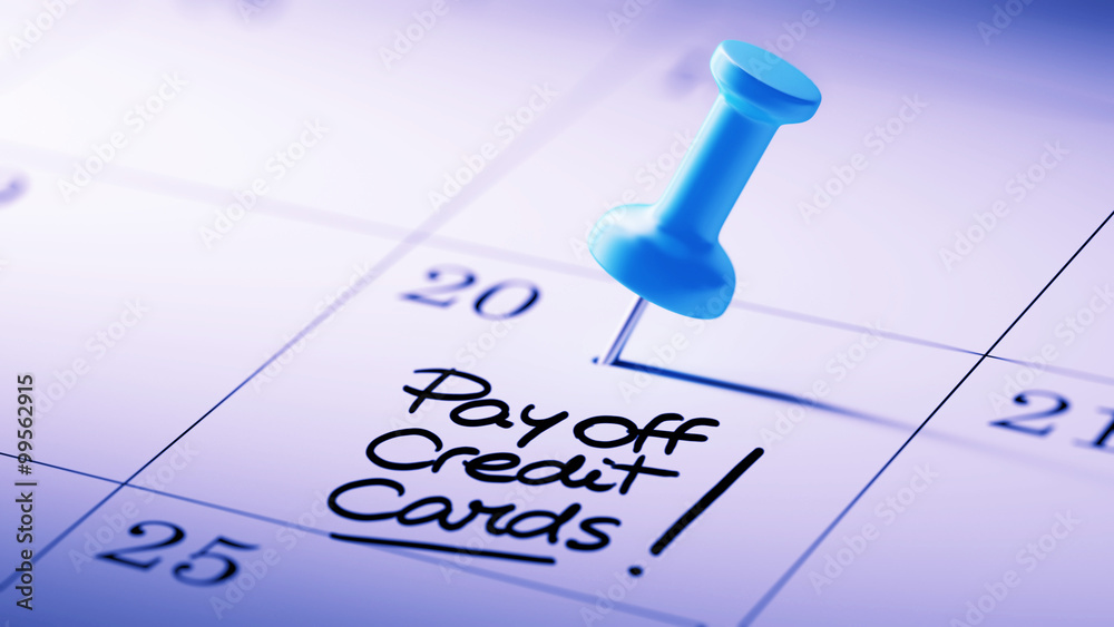 Concept image of a Calendar with a blue push pin. Closeup shot o Concept image of a Calendar with a blue push pin. Closeup shot o