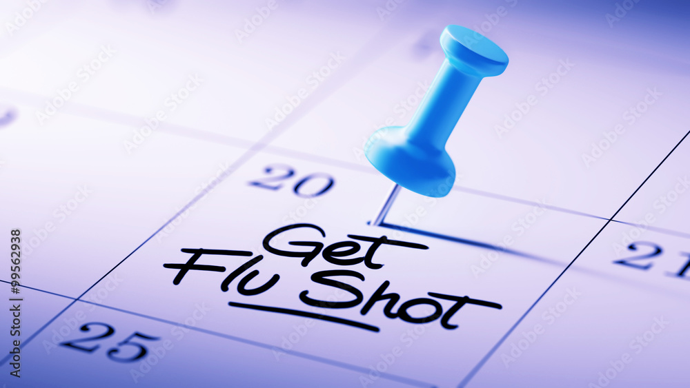 Concept image of a Calendar with a blue push pin. Closeup shot o Concept image of a Calendar with a blue push pin. Closeup shot o