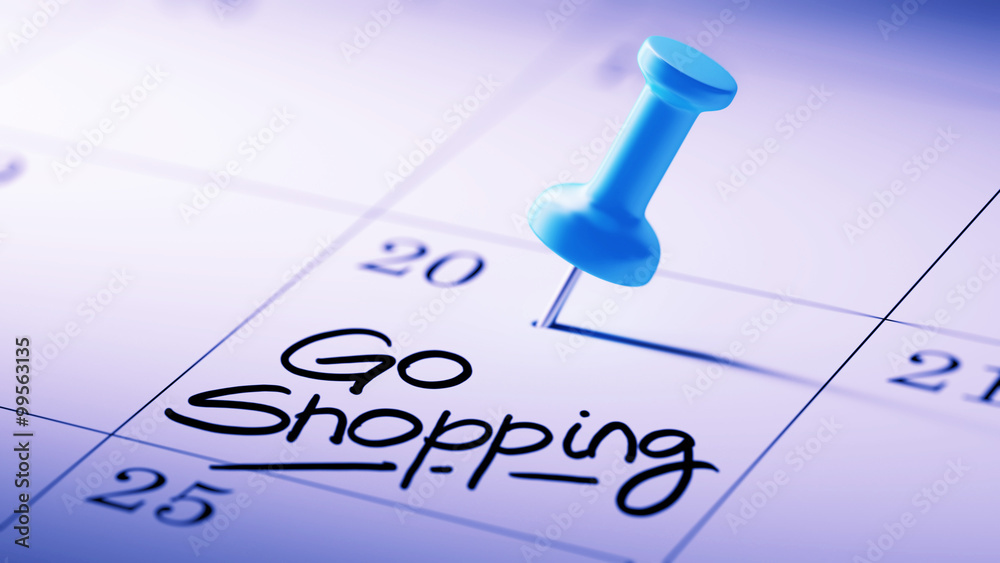 Concept image of a Calendar with a blue push pin. Closeup shot o Concept image of a Calendar with a blue push pin. Closeup shot o