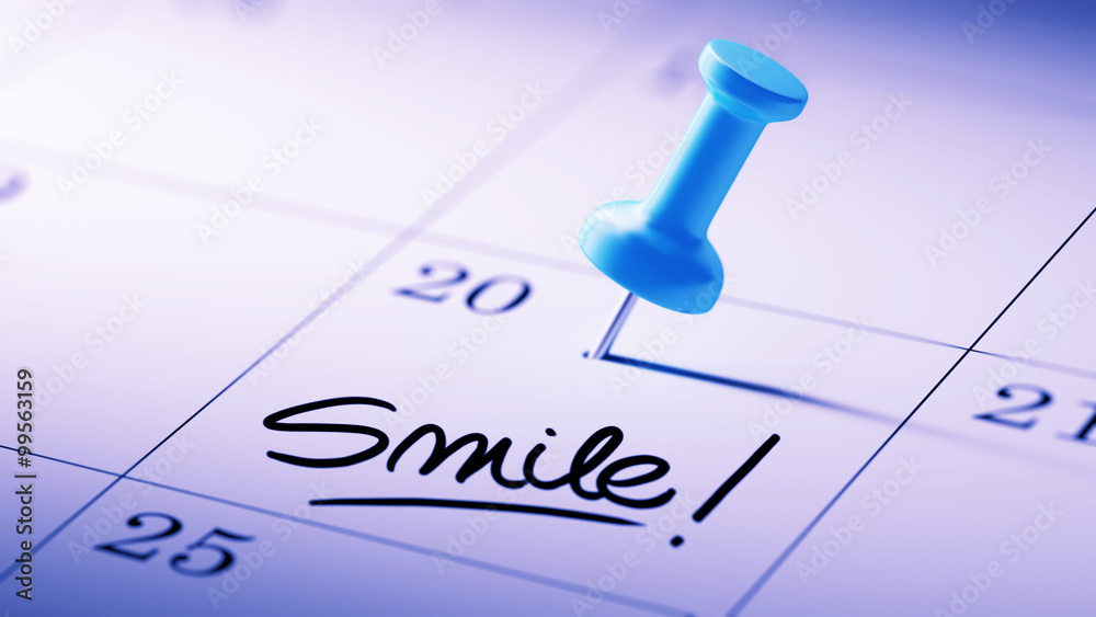 Concept image of a Calendar with a blue push pin. Closeup shot o Concept image of a Calendar with a blue push pin. Closeup shot o