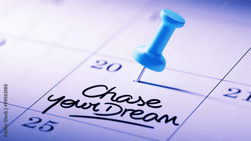 Concept image of a Calendar with a blue push pin. Closeup shot o Concept image of a Calendar with a blue push pin. Closeup shot o
