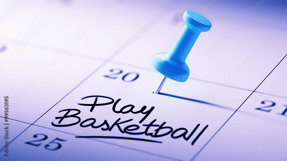 Concept image of a Calendar with a blue push pin. Closeup shot o Concept image of a Calendar with a blue push pin. Closeup shot o