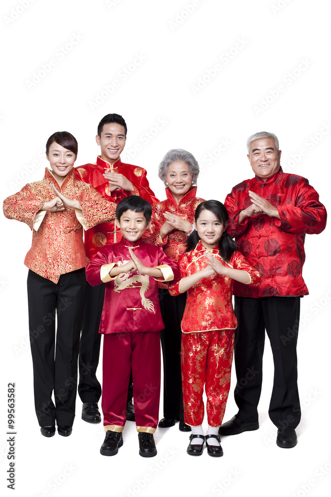 Family Dressed in Traditional Clothing Celebrating Chinese New Year Family Dressed in Traditional Clothing Celebrating Chinese New Year