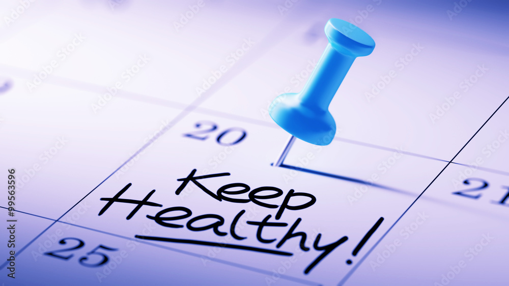 Concept image of a Calendar with a blue push pin. Closeup shot o Concept image of a Calendar with a blue push pin. Closeup shot o
