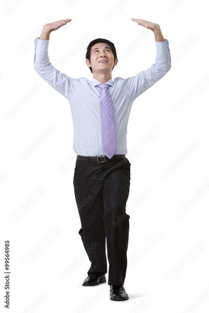 Businessman Carrying an Object Over His Head Businessman Carrying an Object Over His Head