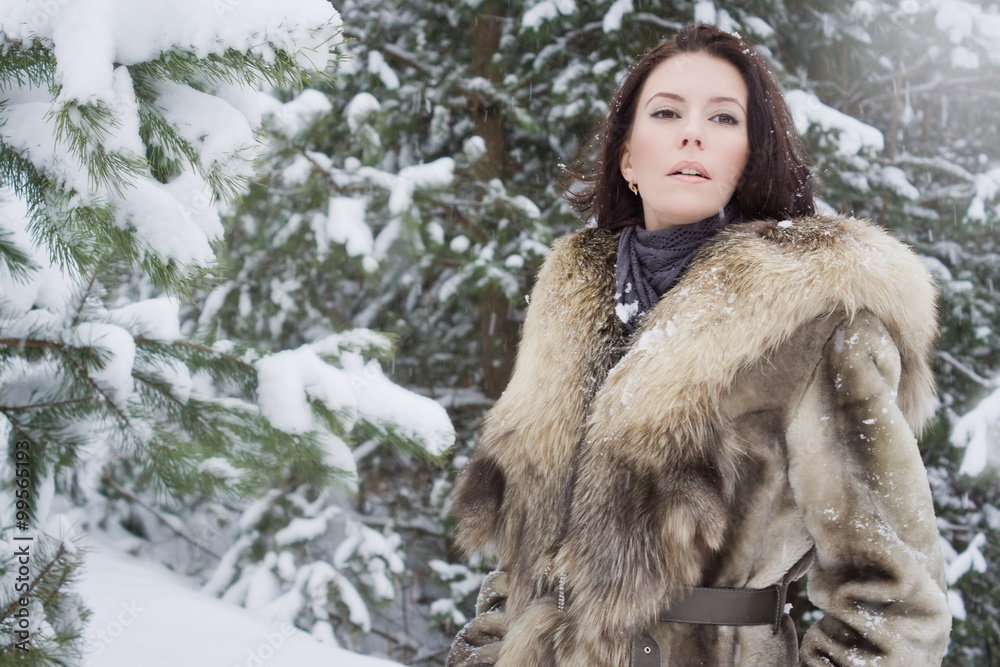 young woman in the winter forest young woman in the winter forest