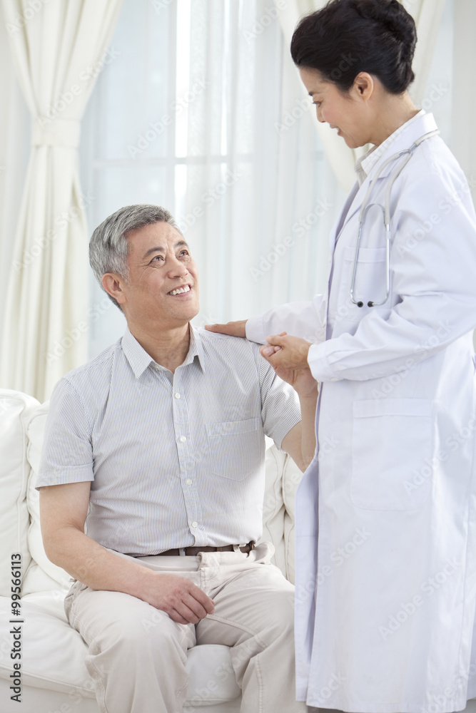 Fototapeta premium Family doctor examing senior patient