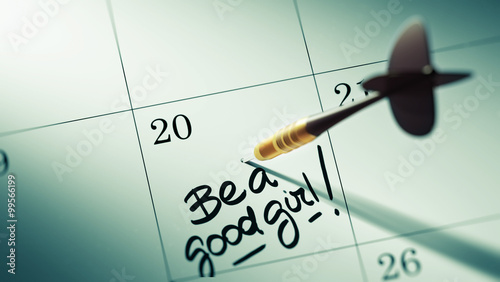 Foto Concept image of a Calendar with a golden dart stick.. The words