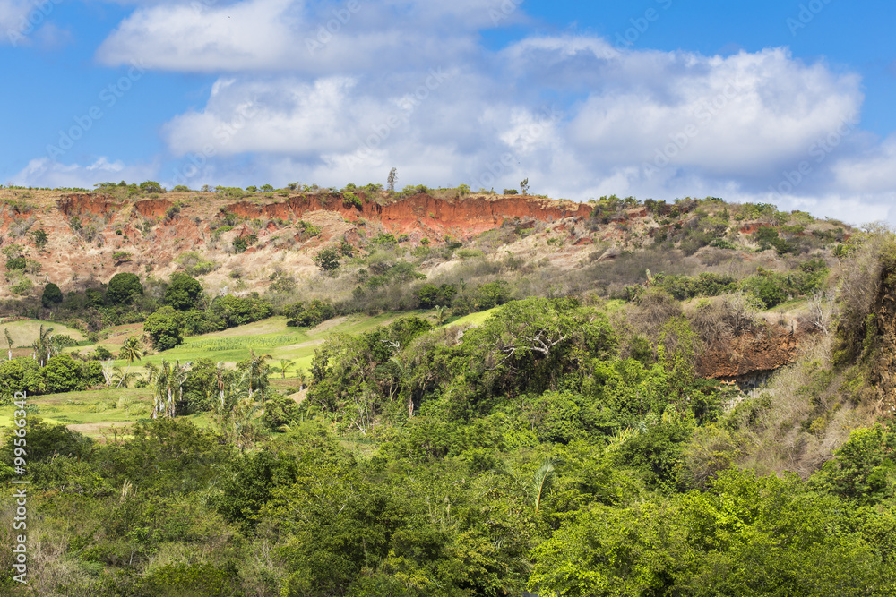 Green landscape with red rocks in Madagascar