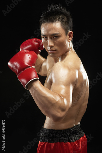 Boxer With Fists Raised © Blue Jean Images