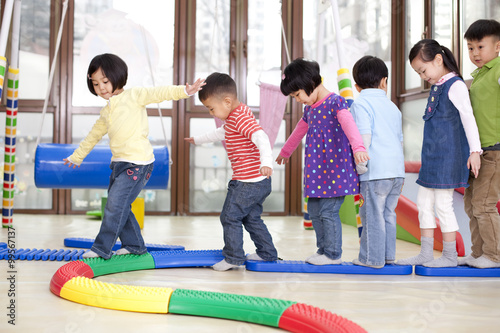 Happy kindergarten children playing games photo