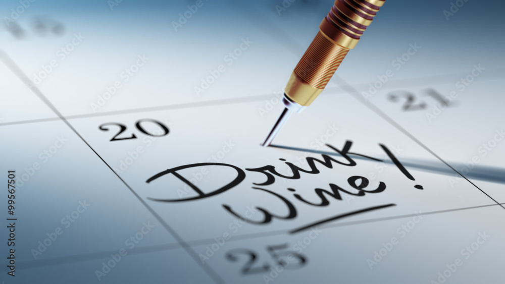 Concept image of a Calendar with a golden dart stick.. The words