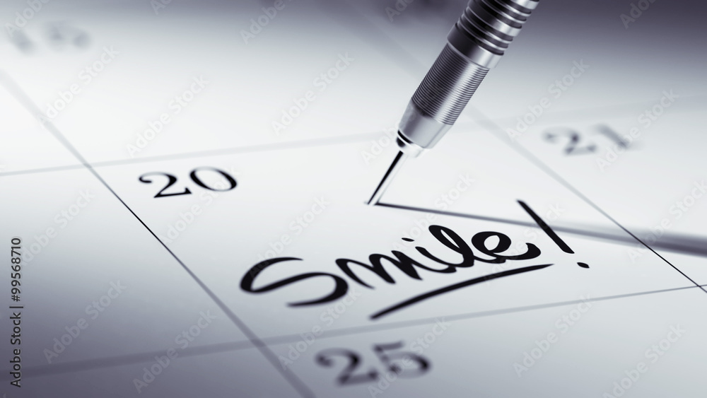 Concept image of a Calendar with a golden dart stick.. The words Concept image of a Calendar with a golden dart stick.. The words