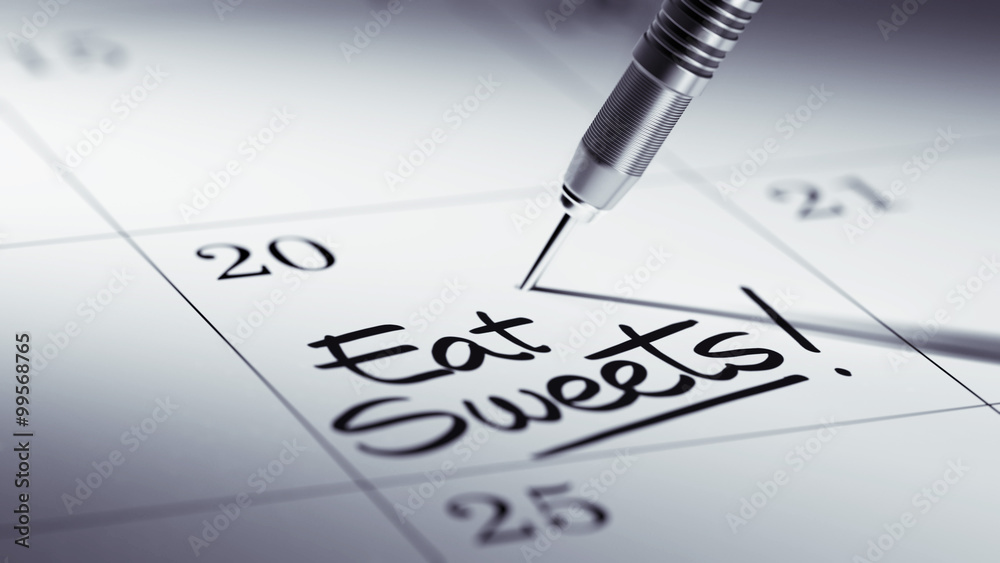 Concept image of a Calendar with a golden dart stick.. The words Concept image of a Calendar with a golden dart stick.. The words