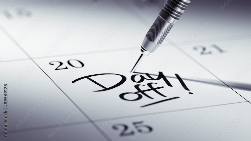 Concept image of a Calendar with a golden dart stick.. The words Concept image of a Calendar with a golden dart stick.. The words