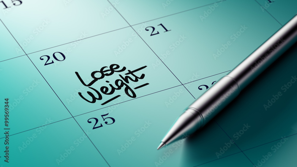 Closeup of a personal agenda setting an important date written w Closeup of a personal agenda setting an important date written w