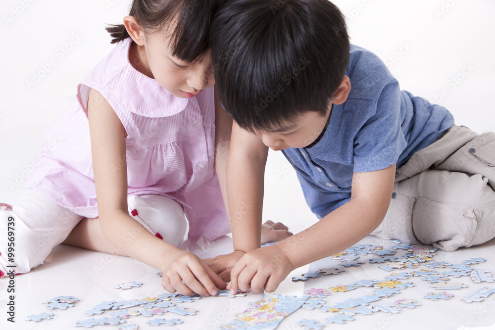 Girl playing jigsaw puzzles Girl playing jigsaw puzzles