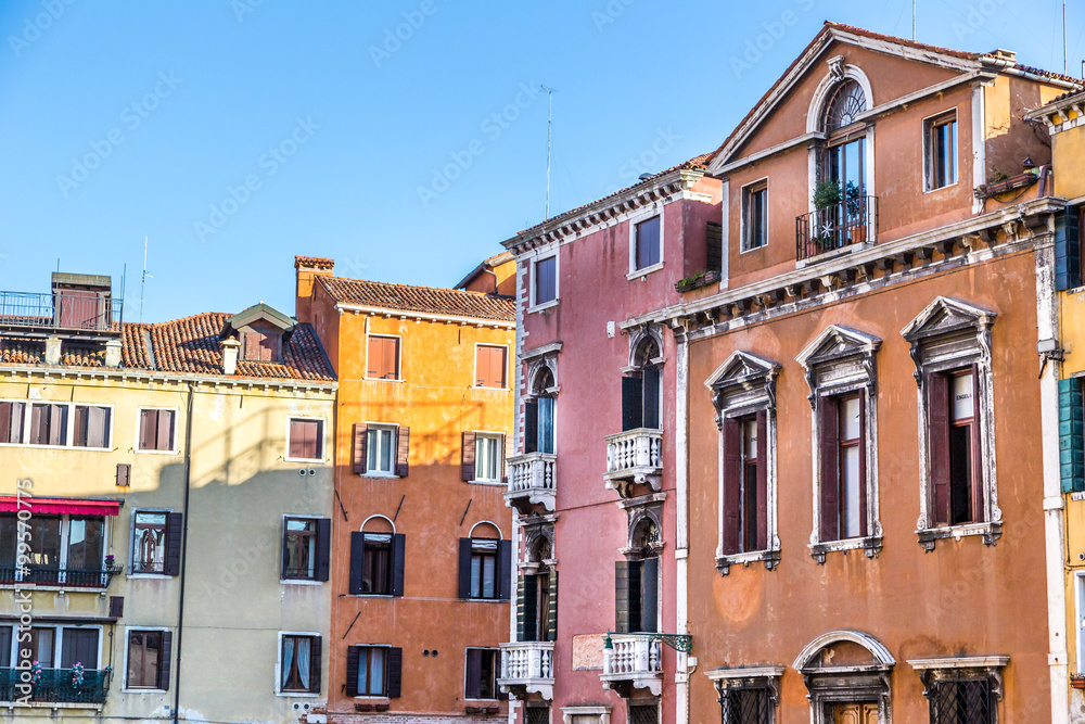 Venice landmark, colorful houses and boats, Italy.