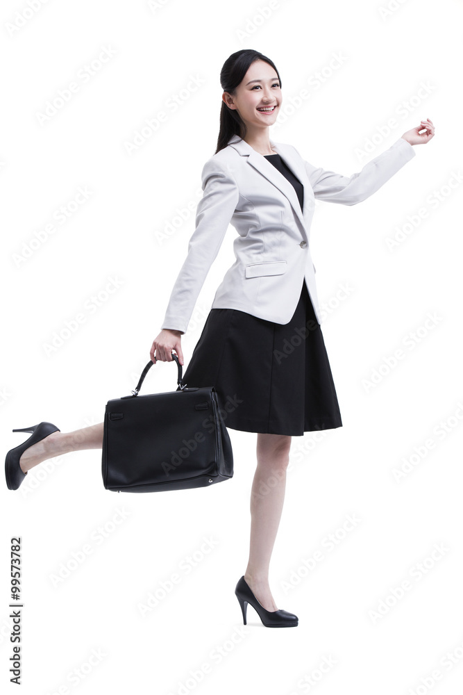Cheerful businesswoman with briefcase in hand Cheerful businesswoman with briefcase in hand