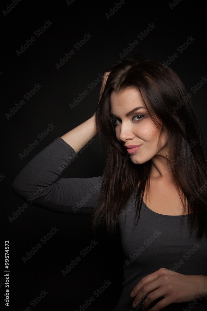 Portrait of a Beautiful Woman Model black background studio - Stock Image