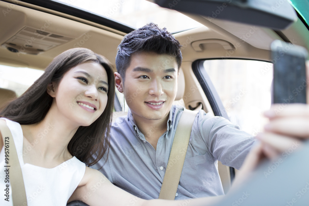 Happy young couple in a car Happy young couple in a car