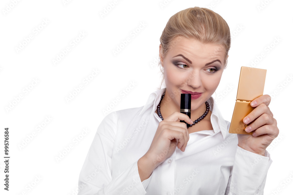 Young Beautiful Business Woman putting make-up - Stock Image Young Beautiful Business Woman putting make-up - Stock Image