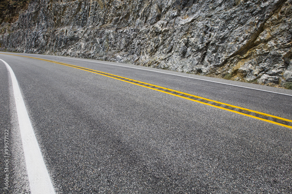 Naklejka premium Road going through the mountains