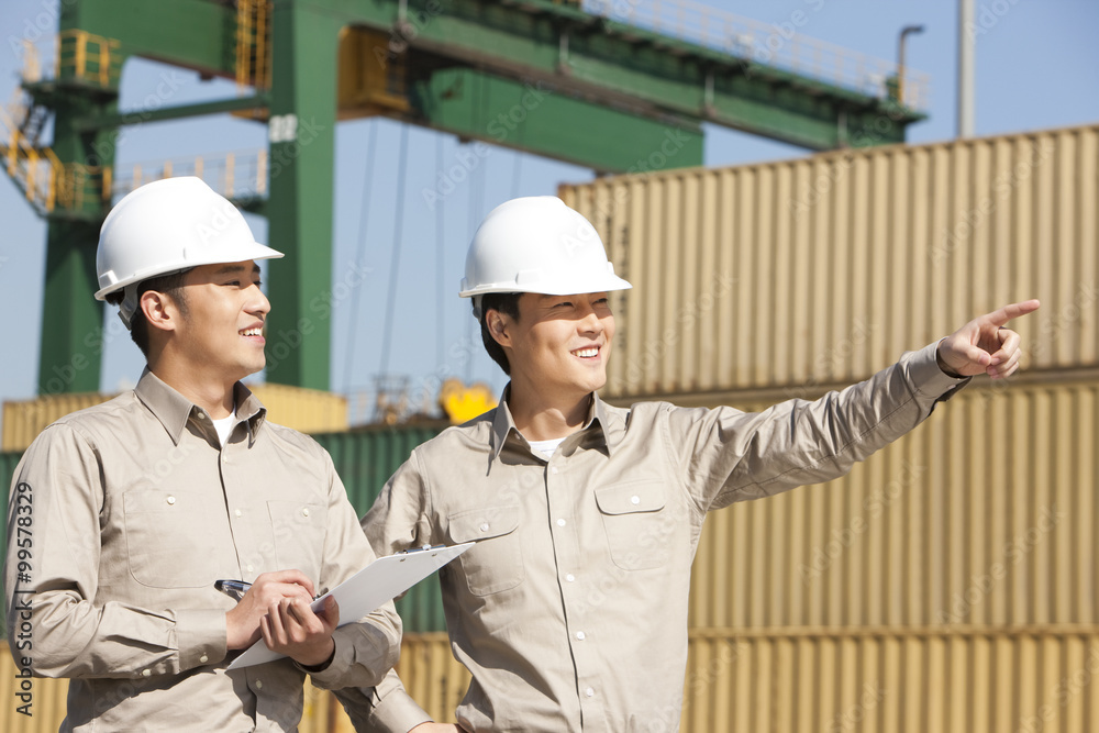 Male shipping industry workers at work Male shipping industry workers at work