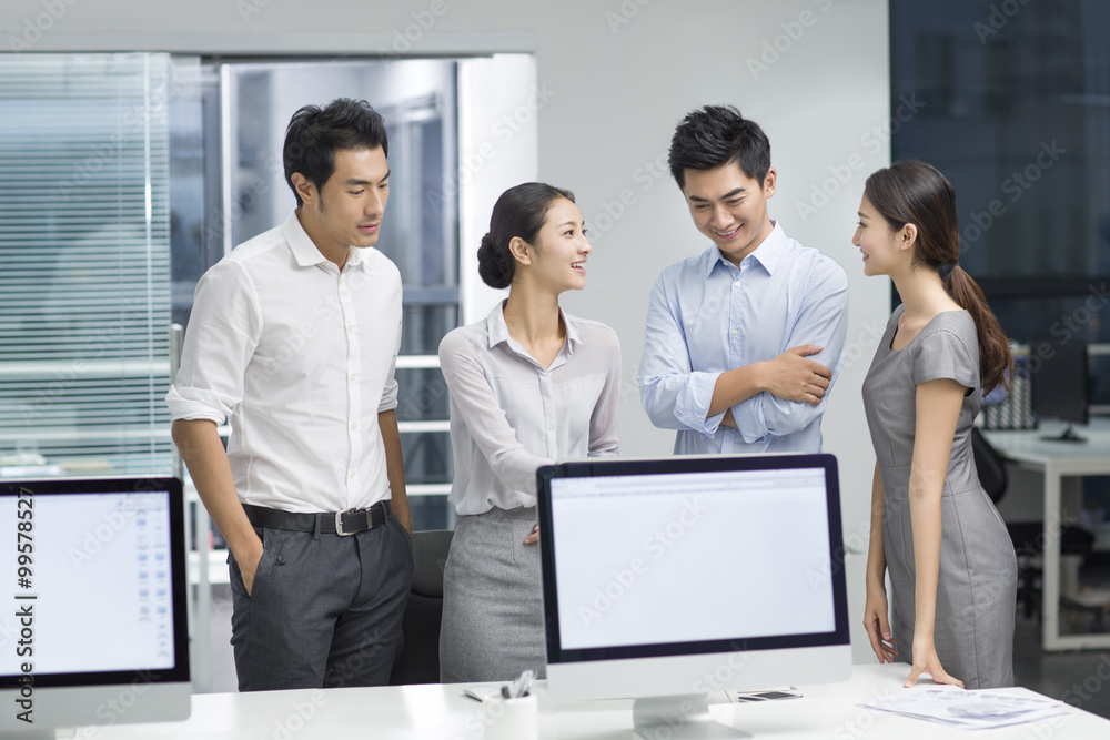 Young business people using computer in office Young business people using computer in office