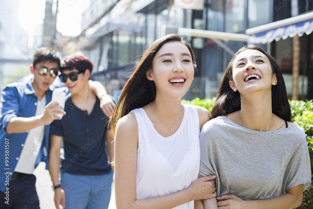 Best female friends walking together on street Best female friends walking together on street