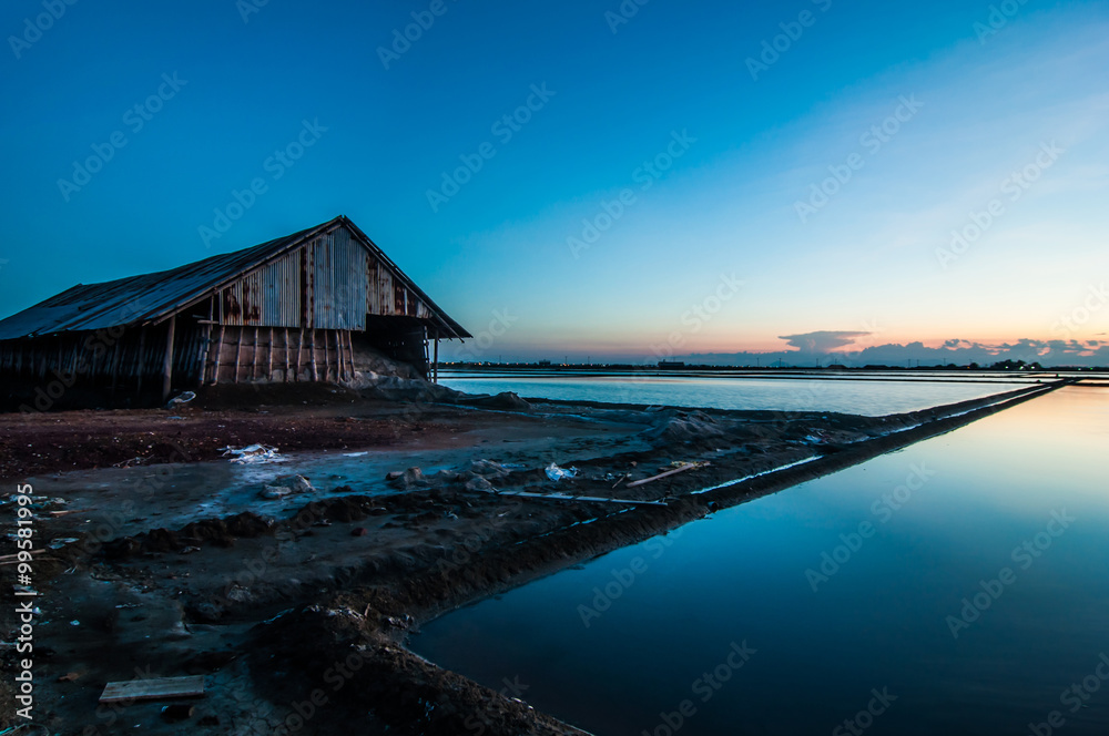 Salt Warehouse sea salt farm of beautiful landscape light sunset.