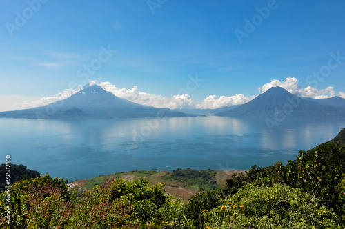 Lago Atitlan along with 2 volcanoes, Panajachel, Guatemala photo
