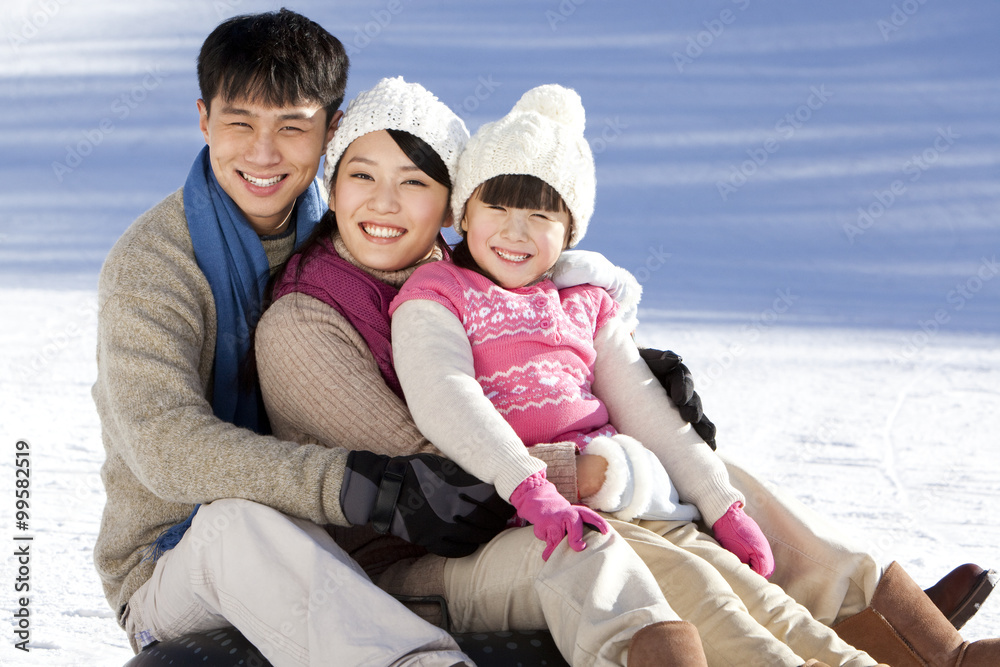 Fototapeta premium Family having fun in snow