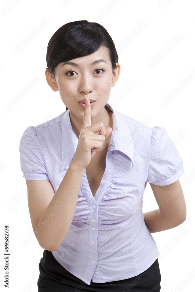 Portrait of a Businesswoman With Finger on Her Lips