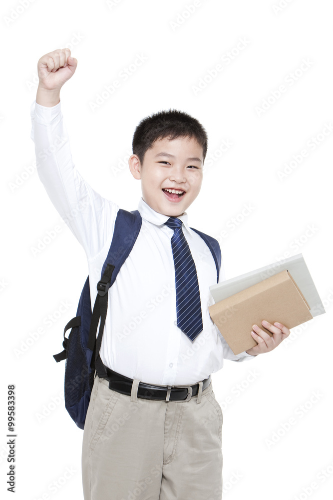 Cheerful schoolboy punching the air with books Cheerful schoolboy punching the air with books
