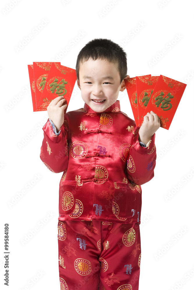 Boy in Chinese traditional clothes holding red envelop Boy in Chinese traditional clothes holding red envelop