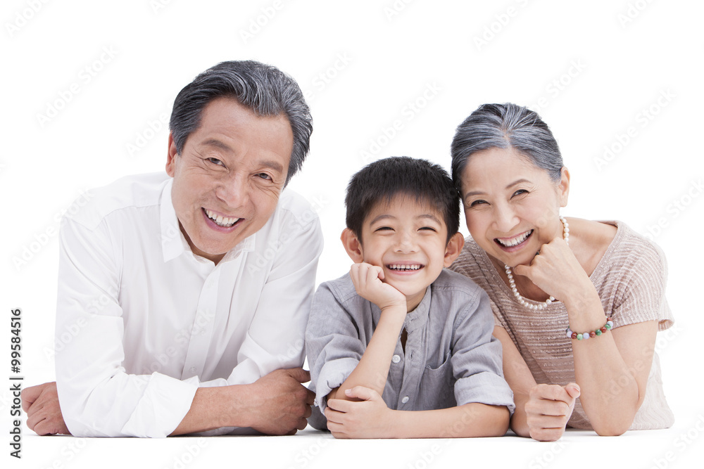 Happy family lying down on ground