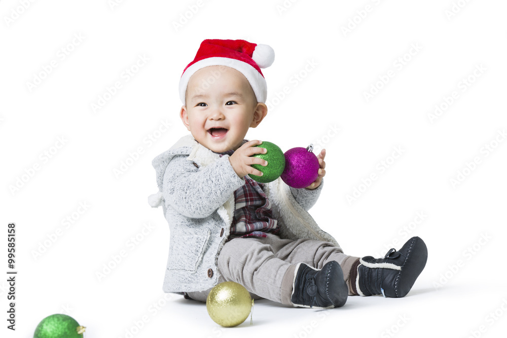 Cute baby playing with Christmas lights Cute baby playing with Christmas lights