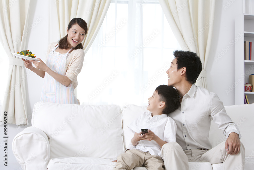 Fototapeta premium Family relaxing in living room