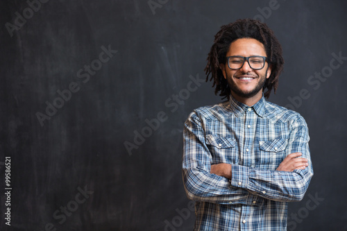 young handsome afro american man gesturing emotional posingon ch